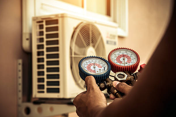 Professional Hvac technician working in Madisonville, LA